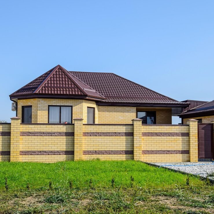 brick-house-with-fence-gates-view-new-builtup-fence-house-made-bricks-corrugated-metal_120587-16176